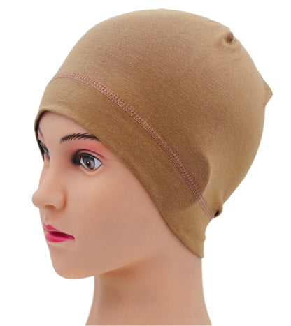 Beige under helmet bean cover on a mannequin head with a white background