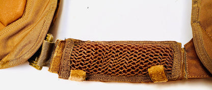 Close-up of a brown shoulder strap or belt with a 3d mesh strap on a white background