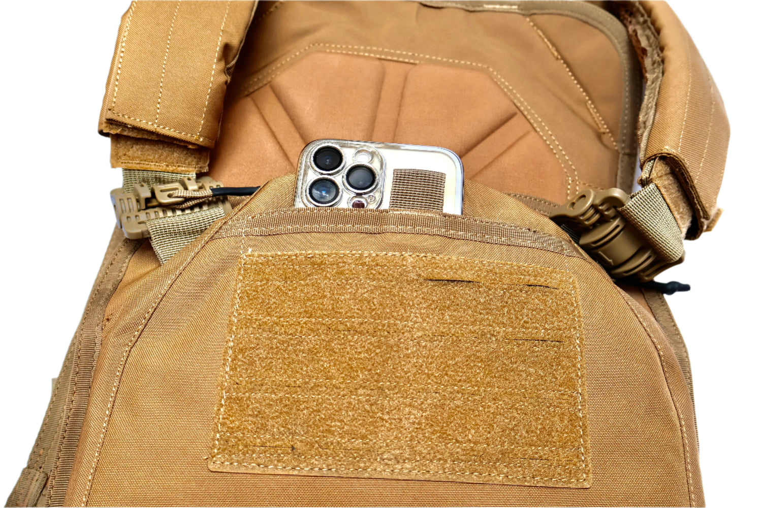 Tan tactical vest with a Phone or storage Pocket on front.