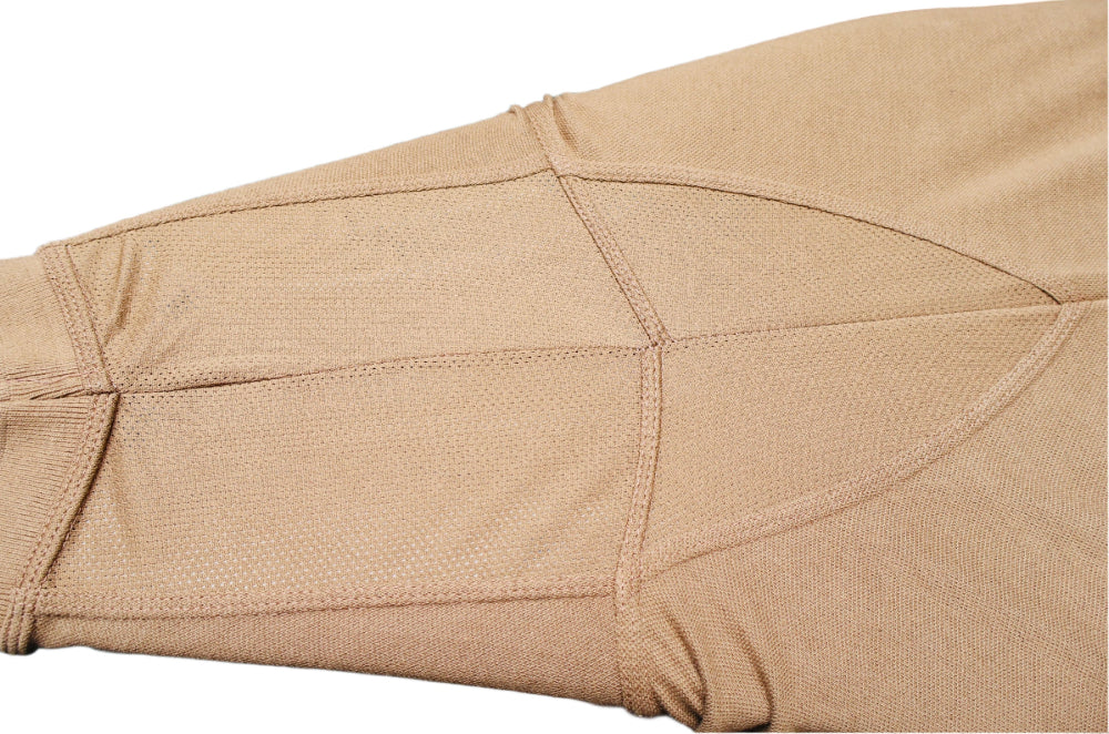 Close-up of Coyote Polo shirt underarm mesh for ventilation or air movement.