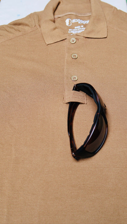 Brown /Coyote polo shirt with a black Sun Glasses on a white background