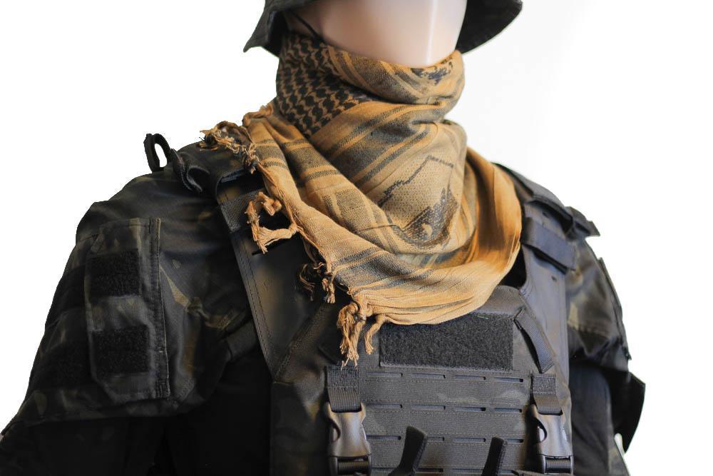 A person wearing a camouflage tactical military scarf on their head and neck.