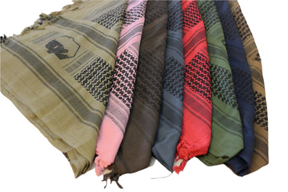 Collection of various colored scarves arranged in a row on a white background