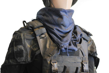 A person wearing a camouflage tactical military scarf  in NavyBlue on their head and neck.