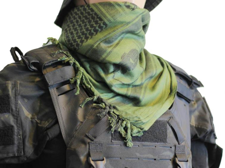 A person wearing a camouflage tactical military scarf on their head and neck.