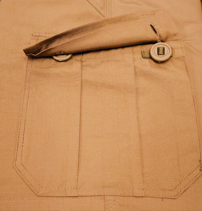 Close-up of a brown pocket with buttons on a matching fabric background
