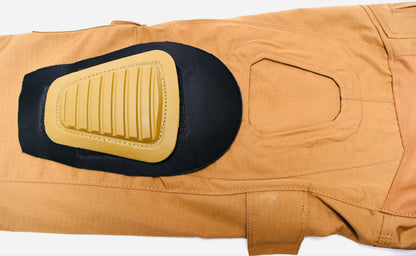 Tan pants with a black and Tan removable knee Pad on a white background