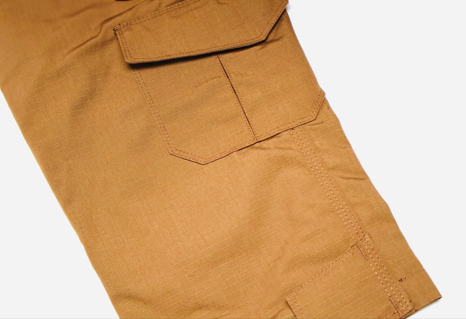 Close-up of brown pants with a pocket on a white background